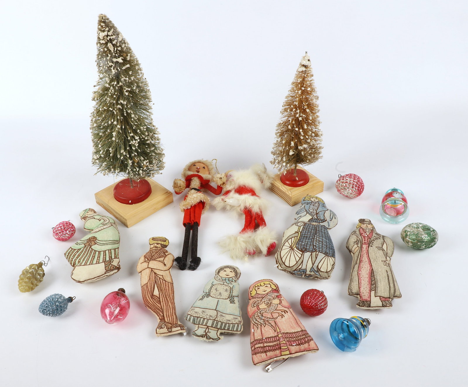 Lot of Vintage Christmas Items: Lot of vintage Christmas items, consisting of (2) brush trees (10" & 13-1/2" h), Santa felt ornament (9-3/4" h), celluloid & flannel Santa with fur (8" h), (9) glass ornaments (largest 3" h), (6) clot