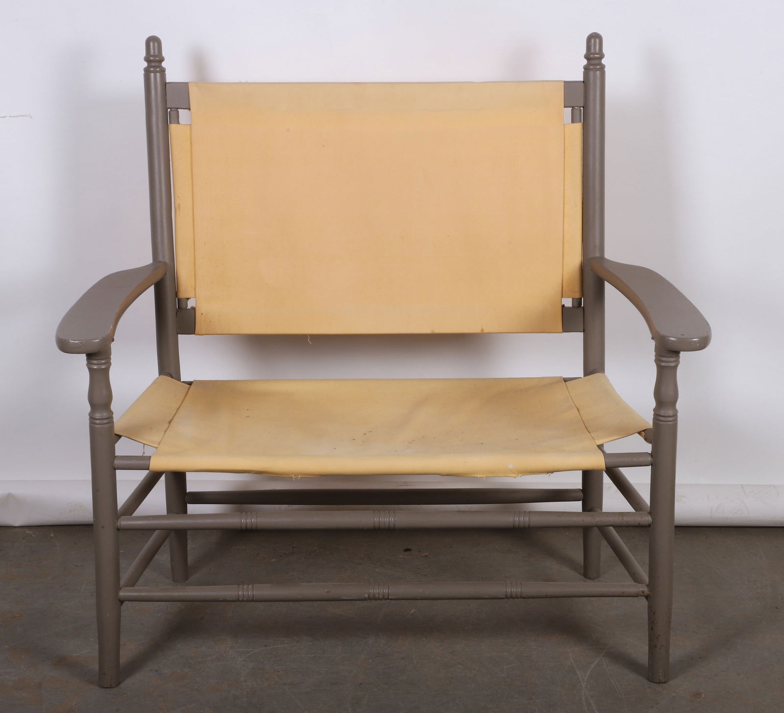 Wood and canvas settee: Wood and canvas settee, gray painted wood frame, yellow canvas back and seating, 41"H x 42"W x 21"D
