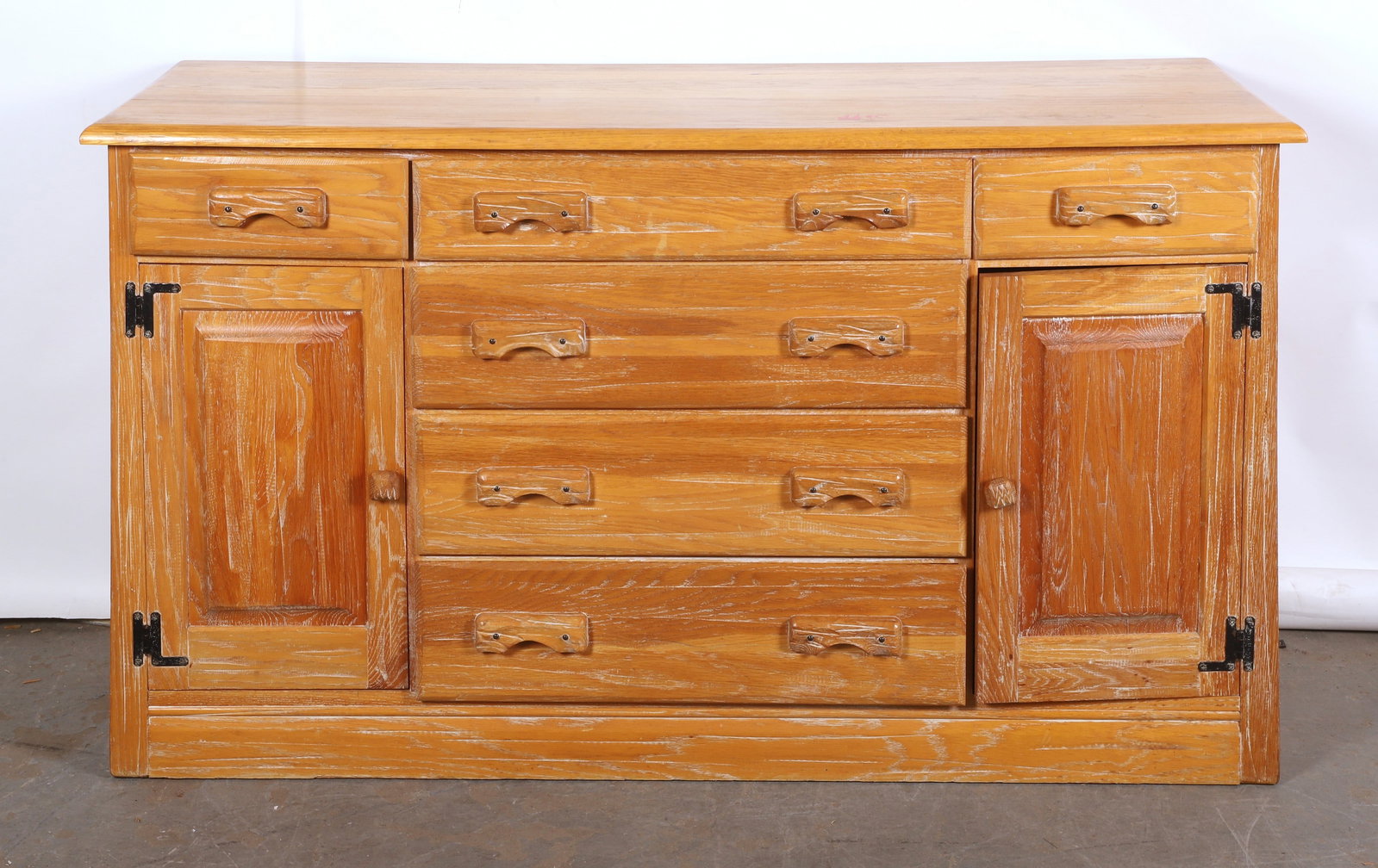 A. Brandt ranch oak buffet: A. Brandt ranch oak buffet, (4) center drawers, flanked by (1) top drawer and (1) chamfered panel door,36"H x 64"W x 21"D, great rustic look, a few areas of watermarks and magic marker on top