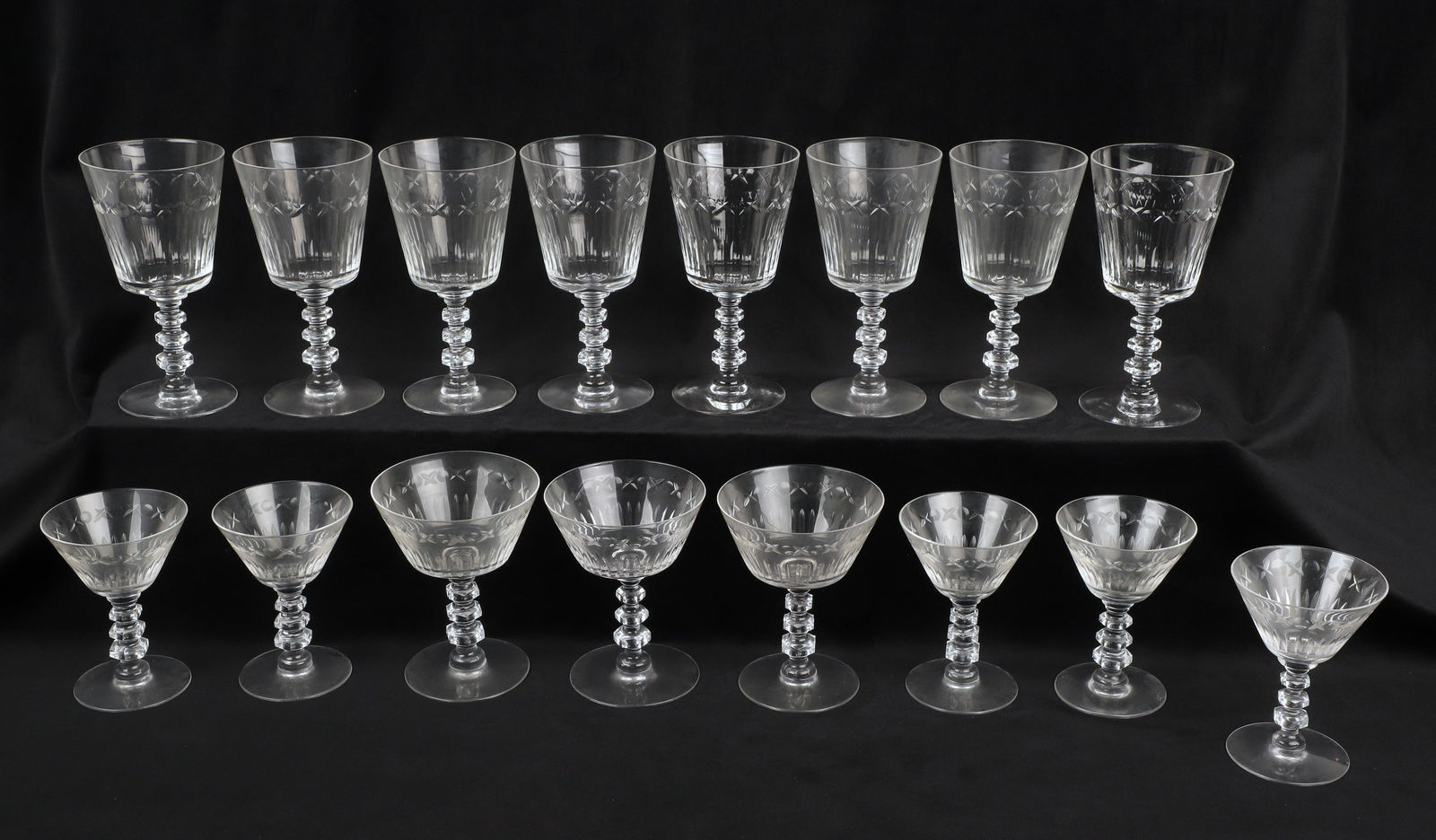 (16) Cut crystal glasses: (1) Cut crystal glasses to include (8) 6 1/4"H glasses, (3) 4 3/4"H glasses and (5) 4 1/4"H glasses