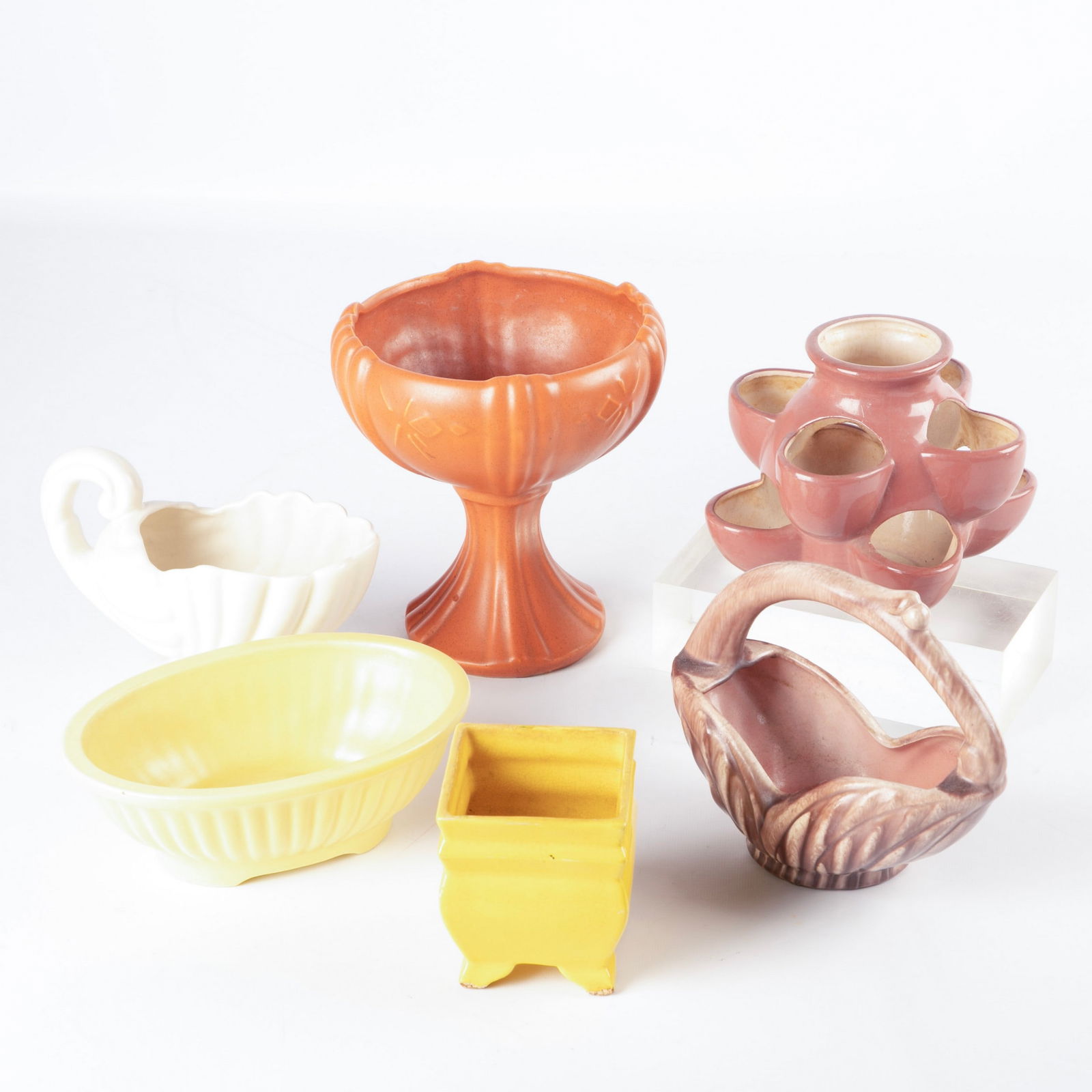 (6) Pottery planters: (6) Pottery planters, including USA 2002 compote (8" h), Gonder basket (6-1/2" h), Haeger cornucopia (5-3/4" h), Haeger yellow shallow bowl (8-1/2" x 5-3/4" x 3" h), unmarked strawberry planter (6" h)