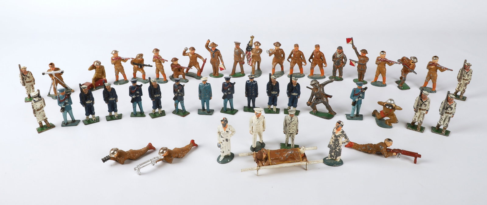 (45) WWI & WWI lead soldiers, sailors & accessories: (45) WWI & WWI lead soldiers, sailors & accessories, consisting of (29) soldiers (two missing helmets), (11) sailors, (4) officers, (1) nurse, litter stretcher & (2) sacks
