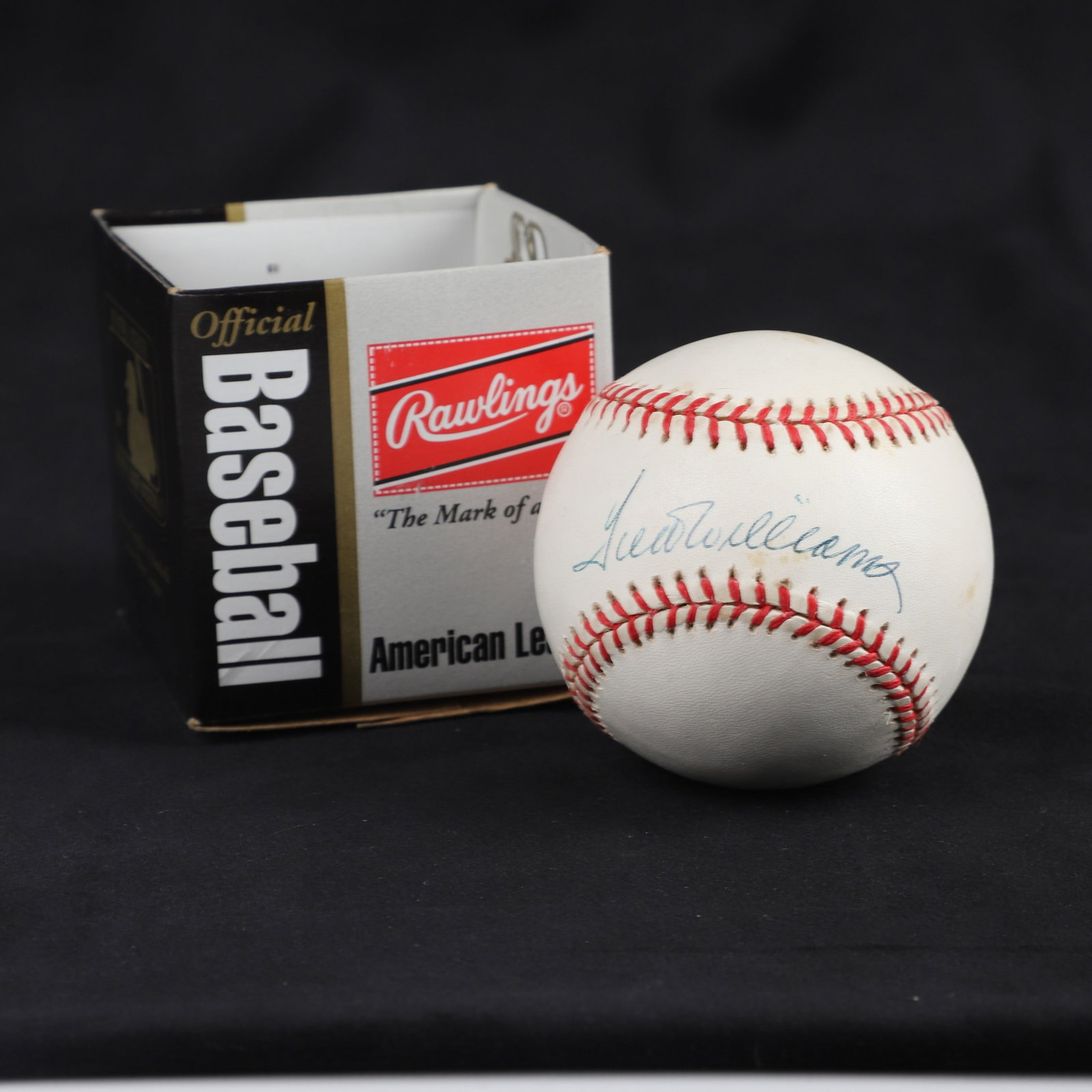 Ted Williams Signed Baseball: Ted Williams signed Rawlings OBAL Blue Ink Sweet Spot. Some discolor, but does not affect signature. Not with specific authenticity.