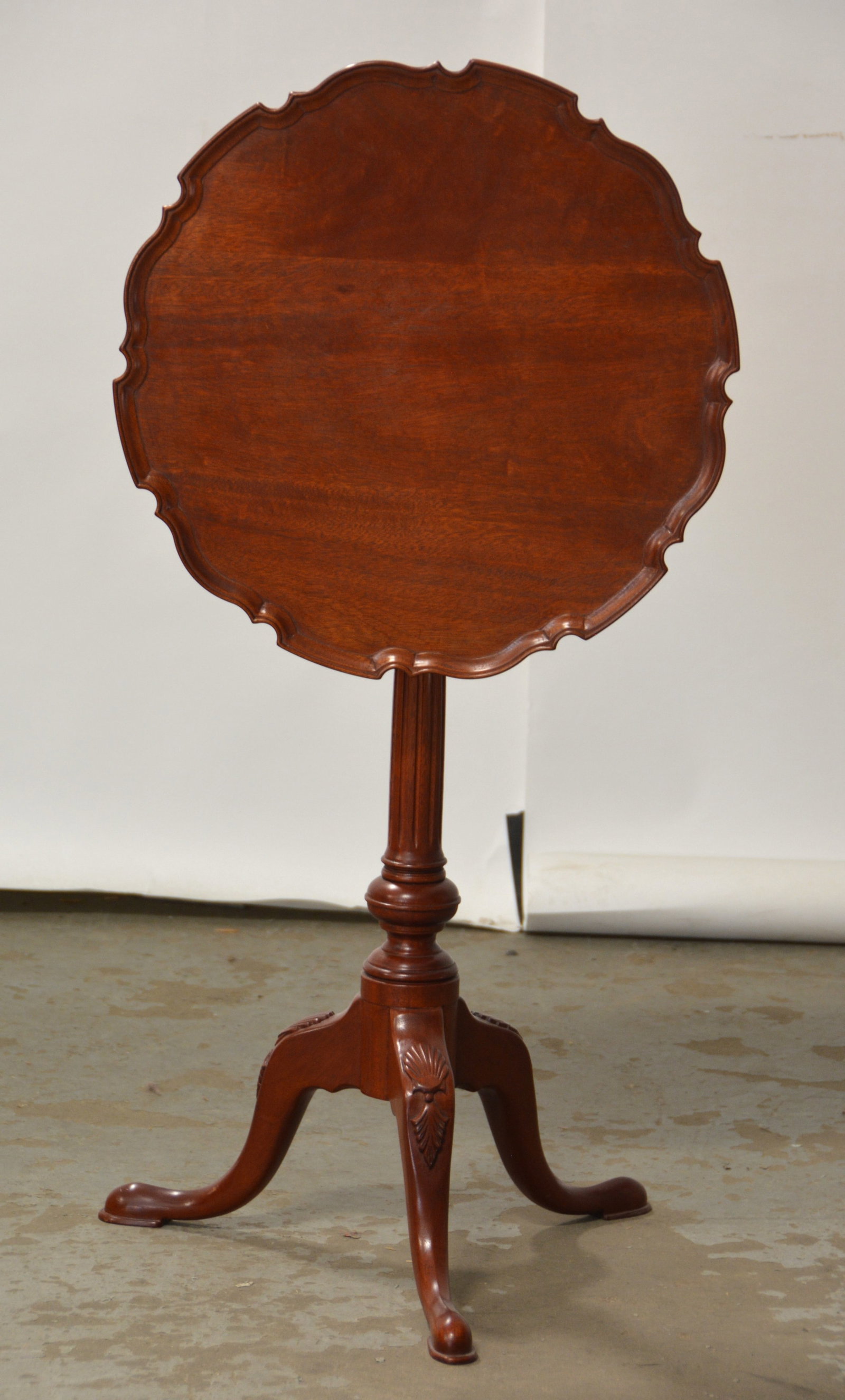 Bartley pie crust edge tilt top table: Bartley mahogany pie crust edge tilt top table, 29"H x 20"Dia