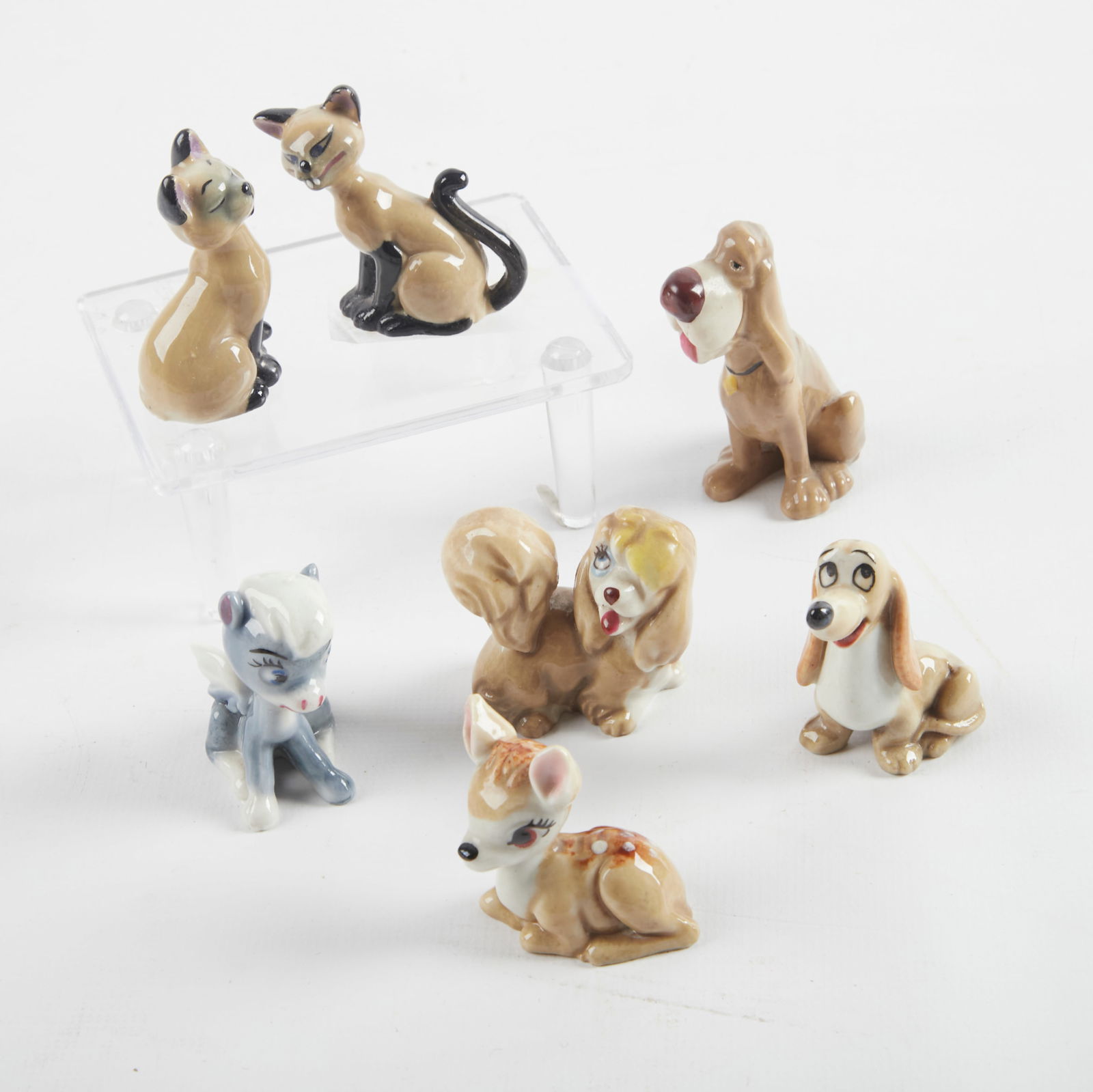 (7) Disney The Hat Box Series figures: (7) Disney The Hat Box Series figurines, Wade porcelain, in original boxes, including Lady and the Tramp "Trusty" #4, Lady and the Tramp "Peg" #5, Bambi "Bambi" #7, Fantasia "Baby Pegasus" #11 (missin