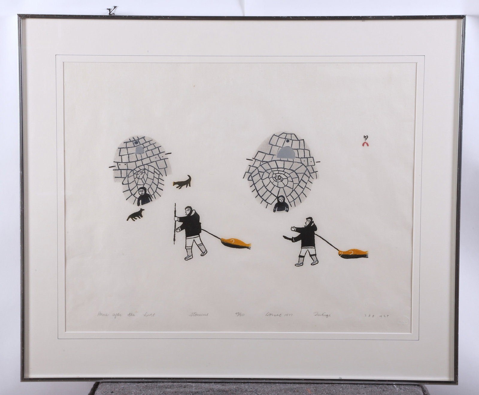 Tukiki Atamik "Home After the Hunt": Tukiki Atamik (Inuit, 1915-1991) "Home After the Hunt", stonecut on paper, signed "Tukiqi", inscribed "Dorset 1977", edition 49/50, 20-1/2" x 26-1/2" sight, framed 28" x 33-1/4", very good condition, 
