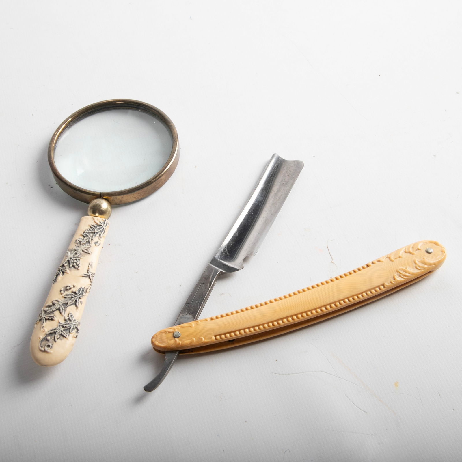 (2) Celluloid handled items (1 of 2)