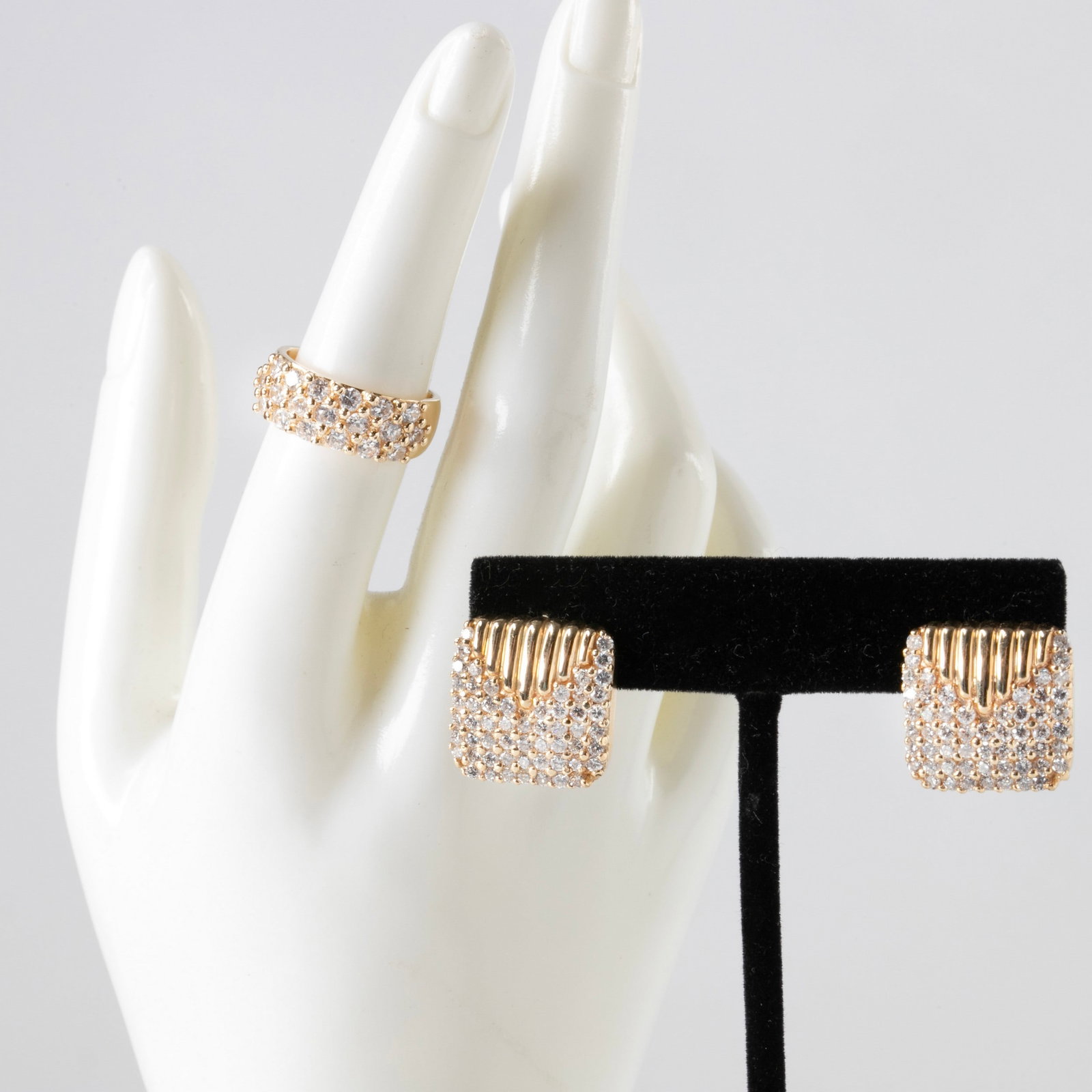 14K Yellow Gold and Diamond Jewelry Set: 14K Yellow gold and diamond jewelry set to include a 14K yellow gold diamond pave band, (19) 1.8 mm diamonds, .47 estimated ctw, along with a pair of similarly designed ribbed and diamond pave square 