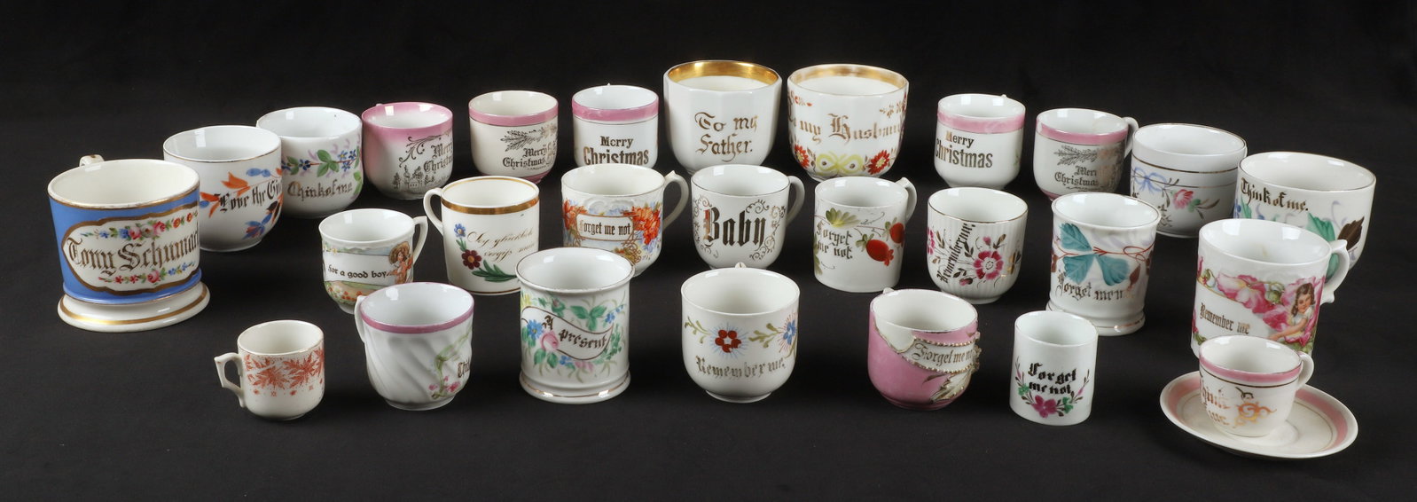 (25+) Porcelain motto cups: (25+) Porcelain motto cups, including "Merry Christmas", "Forget Me Not", "Remember Me", "Think of Me", "A Gift", "To My Father", "To My Mother", and more, some with chips