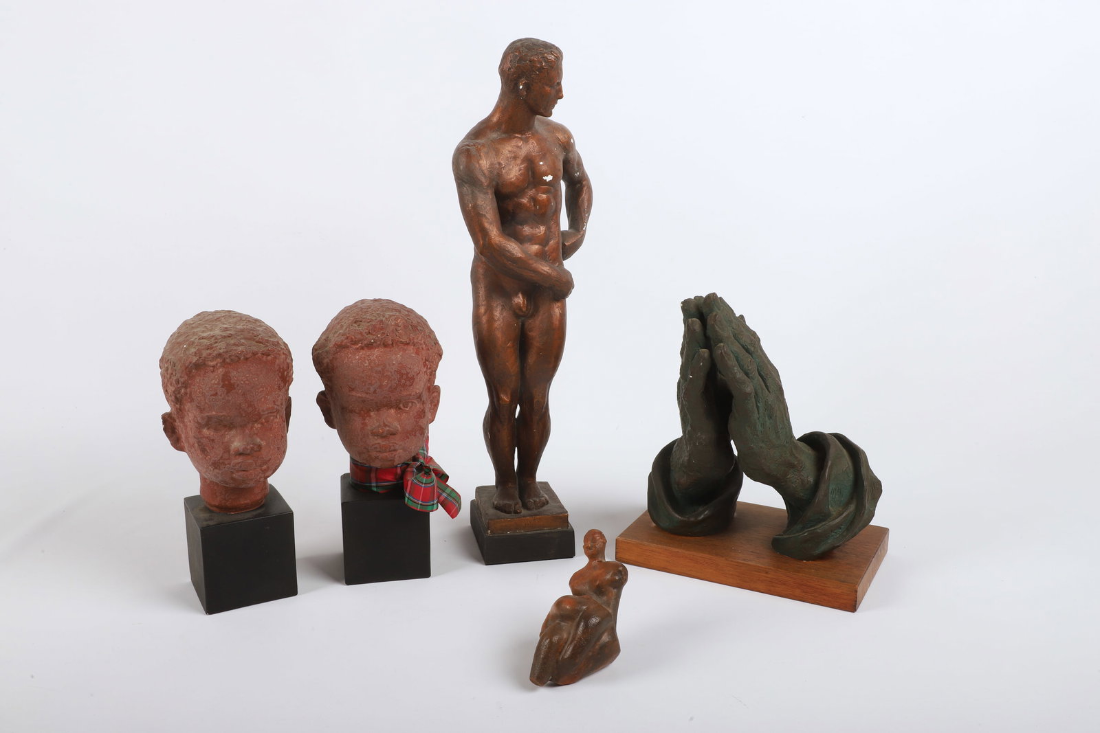 (5) Pottery figural sculptures: (5) Pottery figural sculptures, including chalkware praying hands signed "JPG" (9-3/4" h), chalkware standing nude male signed "B Kling '40" 17" h), unsigned boy & girl busts (9" h), erotic figure sig