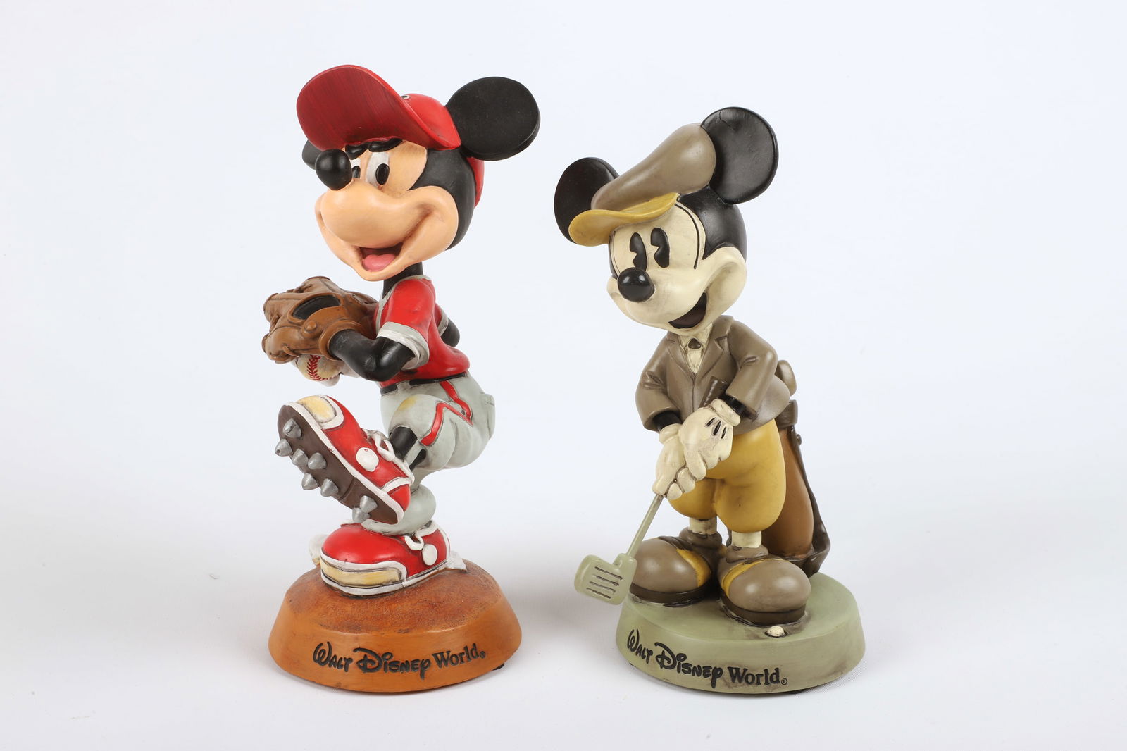 (2) Walt Disney World Mickey Mouse bobble heads: (2) Walt Disney World Mickey Mouse bobble head figures, including baseball player (9" h), golfer (8-1/2" h)