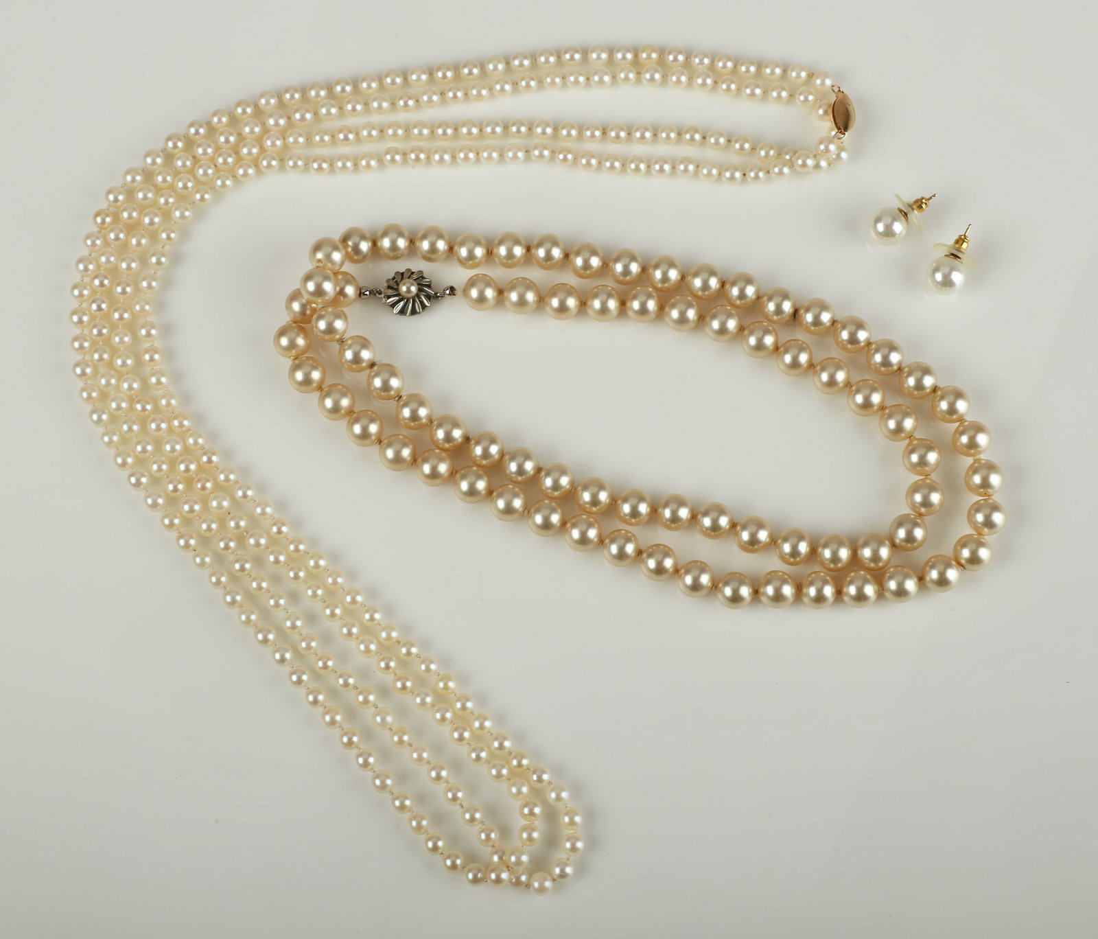 Freshwater Rope Pearl Necklace, 68"L: Freshwater Rope Pearl Necklace, 68"L with 14K yellow gold closure, 5.8 mm nearly round pearls, 14K yellow gold lozenge shaped closure. Also to include a strand of Pearlex faux pearls with silver closu