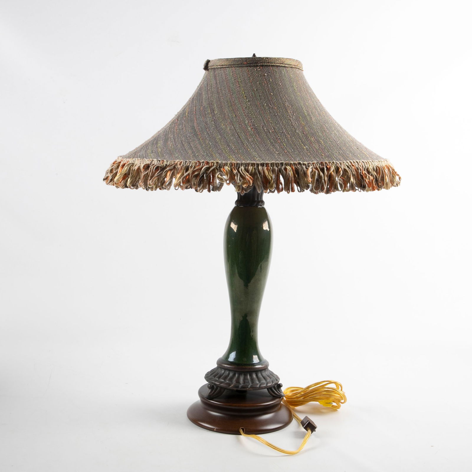 Frederick Cooper table lamp: Frederick Cooper table lamp, urn form porcelain stem with metal mountings, fabric shade with ribbon fringe, 19" dia x 25-1/2" h