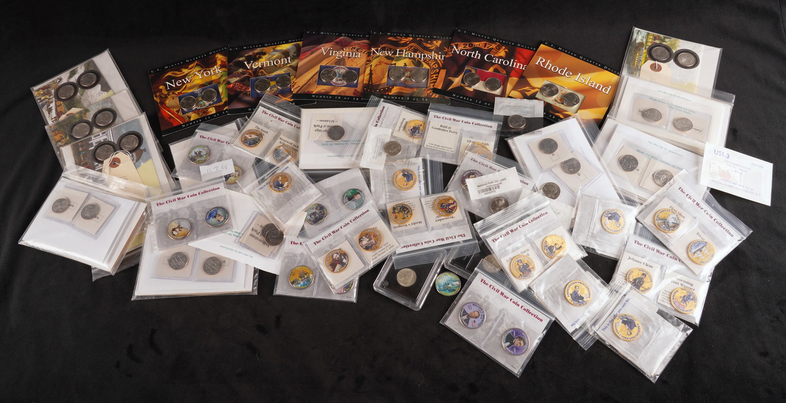 A Collection of State Quarters and Stamps: A Collection of state quarters and stamps including Civil War Collection quarters, state stamps and state quarters.