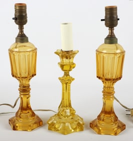 Pair of amber whale oil lamps & uranium candlestick