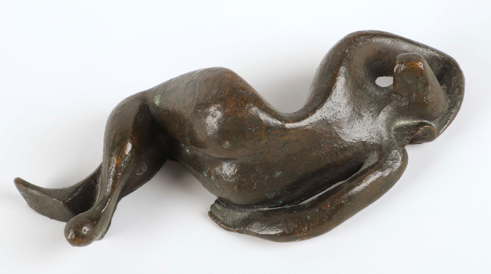 Bronze stylized sculpture of sleeping woman: Bronze stylized sculpture of reclining sleeping nude woman, unsigned, 9" l x 2-1/2" h