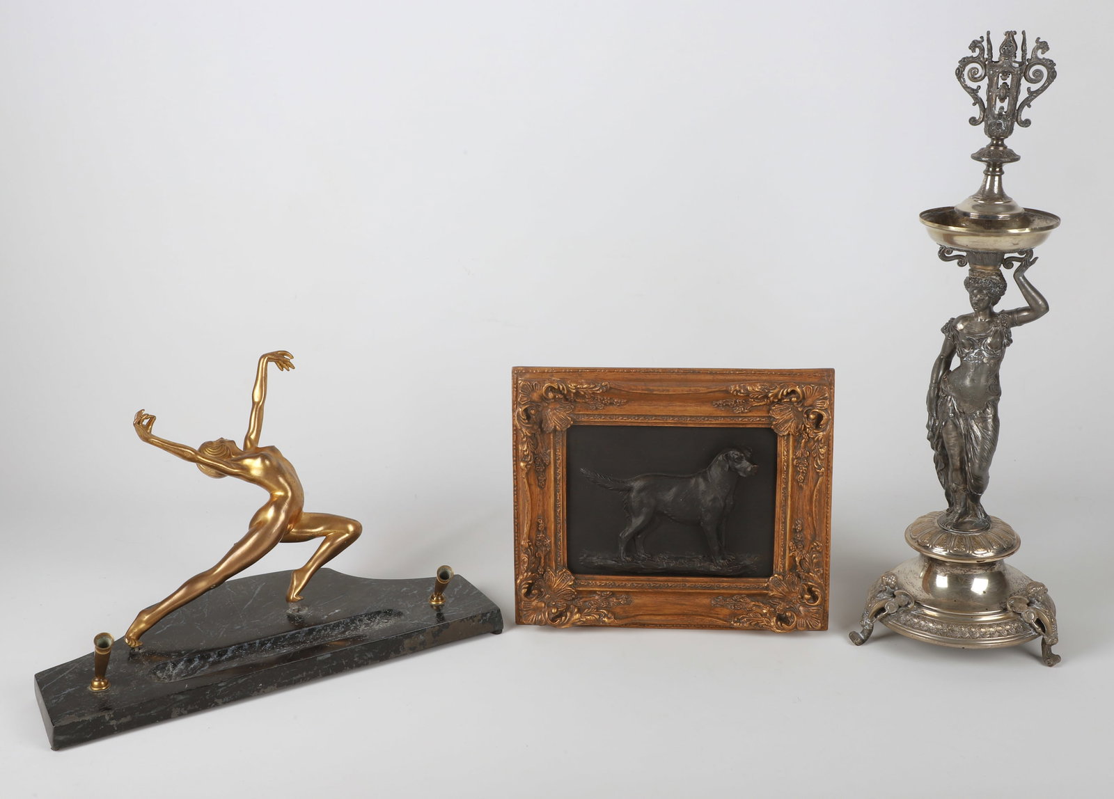 (3) Decorative items: (3) Decorative items, including 3D dog plaque in relief (11-1/2" x 9-3/4"), silvered statue of woman (21-1/2" h, missing tray), Art Deco gilt nude dancer desk pen holder (15-3/4" x 7-1/4" x 10"h, miss