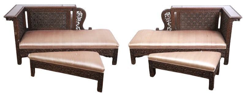 Pair of oak carved chaises with ottomans: Pair of oak carved chaises with ottomans, raf and laf chaise lounges, wide armrests, with carved vine and floral borders, frames heavily carved with vine and floral motif, back and side are adorned wi