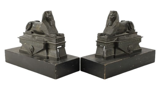 Pair of black metal sphynx fire dogs