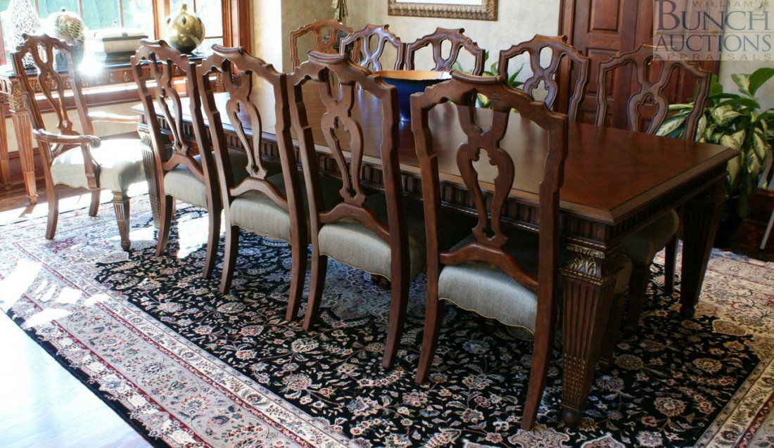 Walnut Italian provincial style dining table and 1: Walnut Italian provincial style dining table and 10 chairs, 2 with arms by Marge Carson, closed dimension 82"x48" with 2 22 1/2" leaves, 126" overall