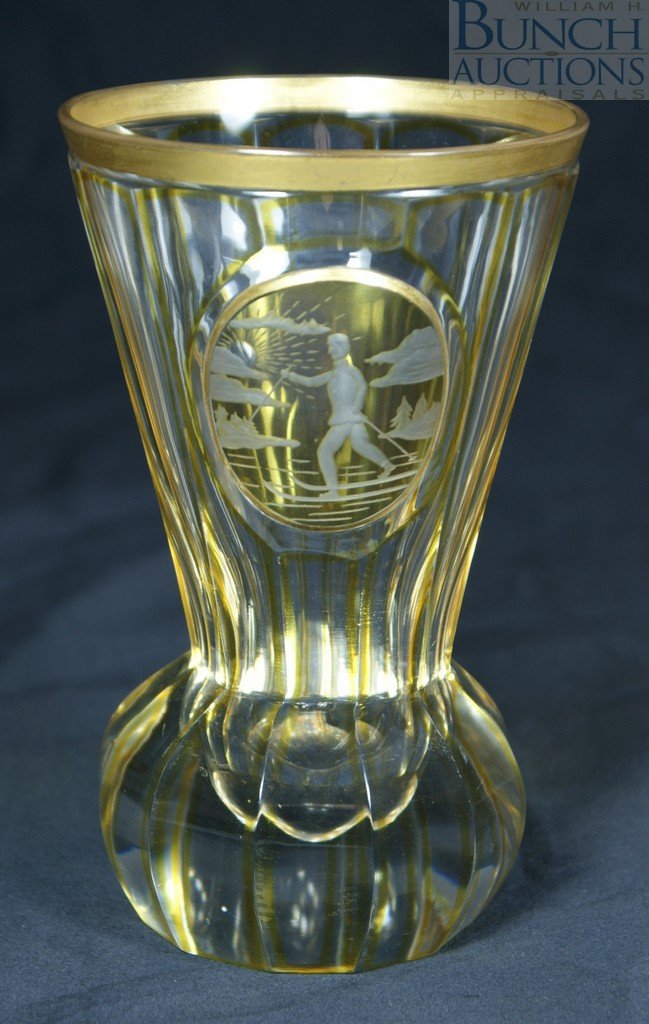 Bohemian amber and clear glass beaker with oval : Bohemian amber and clear glass beaker with oval panel depicting a skier, 5 1/4" tall