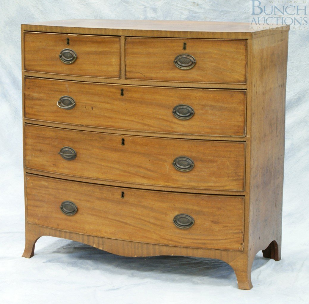 Mahogany Georgian Hepplewhite bow front bureau,: Mahogany Georgian Hepplewhite bow front bureau, 2 short over 3 long drawers with replaced brasses, raised on French feet, some splits in veneer and damage to some of the applied beading, 39-1/2" wide,