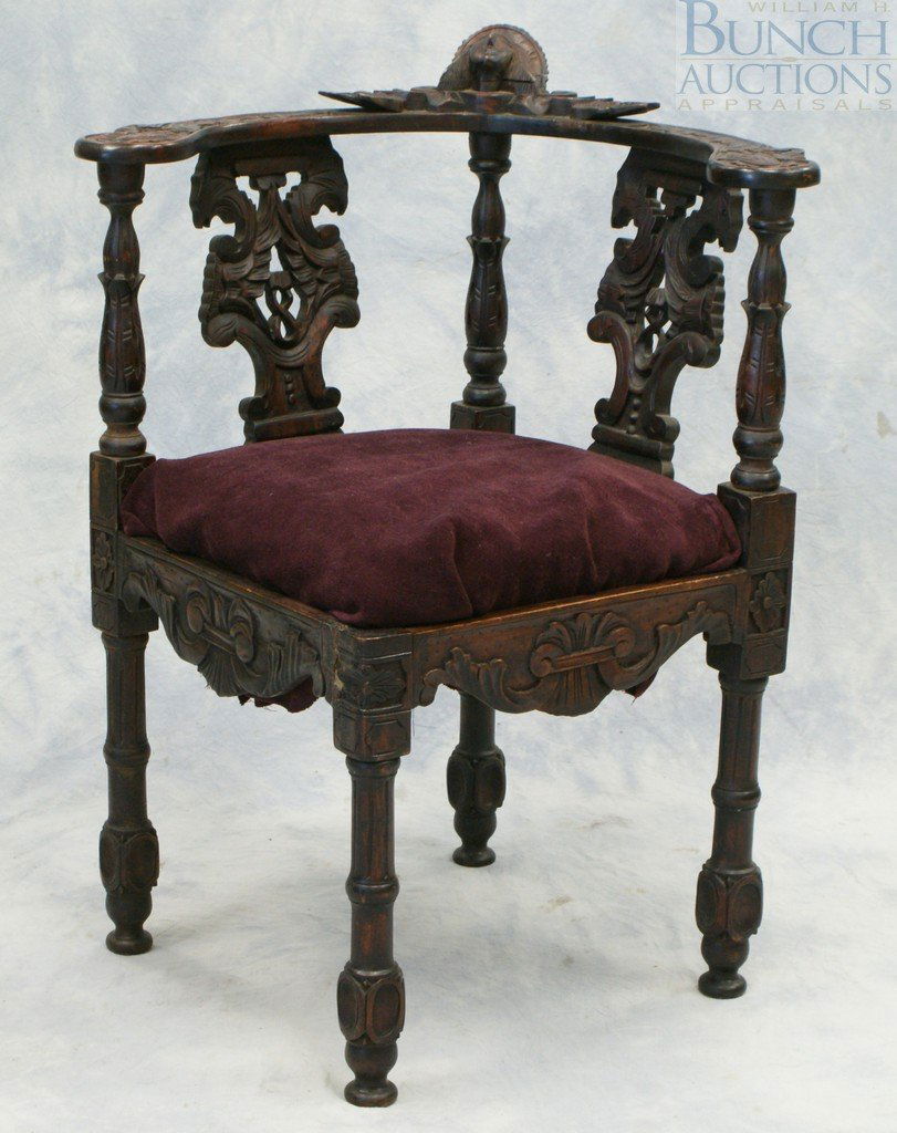 Carved Mahogany Corner Chair with ladies head c: Carved Mahogany Corner Chair with ladies head crest, plats carved with birds heads, 35" high