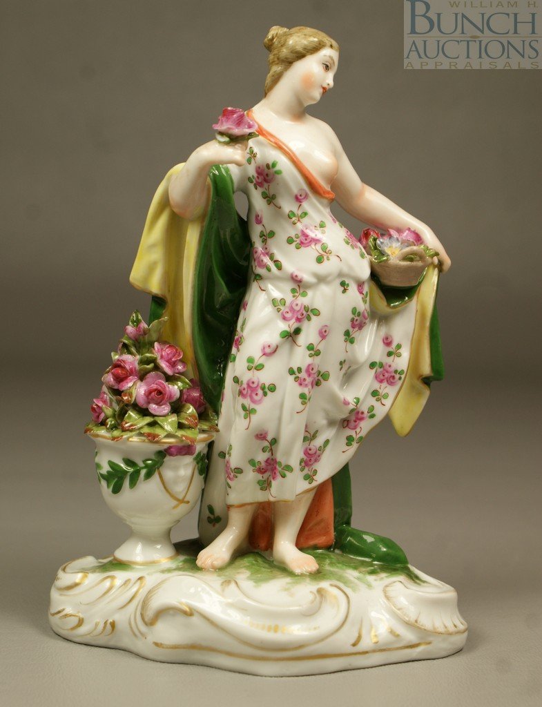Ludwigsburg figurine of a young woman gathering : Ludwigsburg figurine of a young woman gathering flowers, one bare breast, blue mark, flakes to flower, no other damage noted, 5 3/4" tall