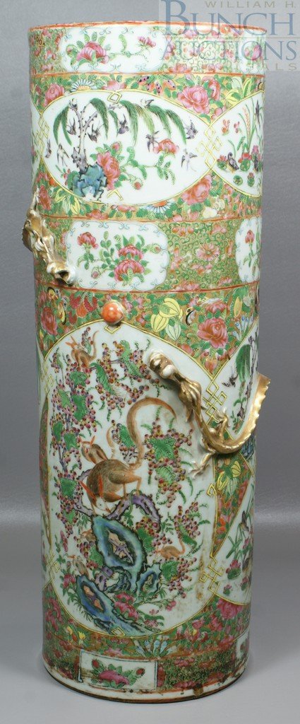 Famille Rose Chinese porcelain umbrella stand, t: Famille Rose Chinese porcelain umbrella stand, the body with gilt dragons pursuing the pearl, 24 1/2" h, 8 3/4" d, some wear to gilt, dragon's mouth is badly chipped, approximately 14" crack from top 