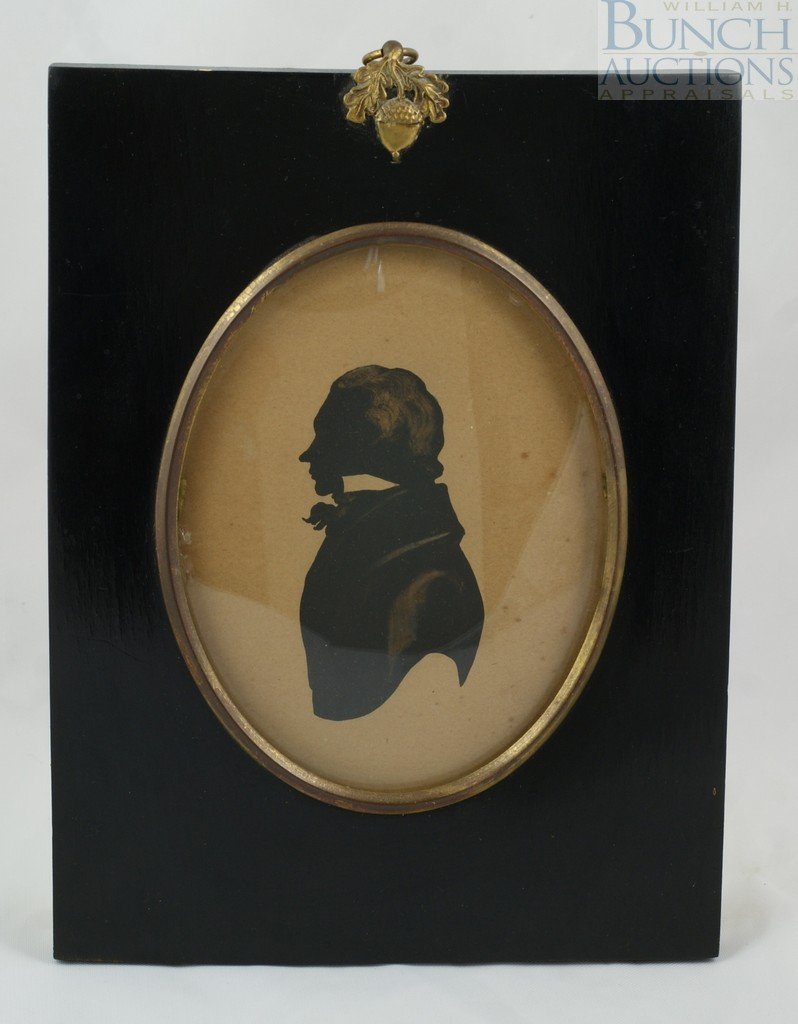 C. 1820 portrait of a gentleman. Painted silhoue: C. 1820 portrait of a gentleman. Painted silhouette with gilded highlights at hair, neck and shoulder. In ebony frame with brass inner bezel, convex glass, and oak leaf and acorn clasp. 5x4"