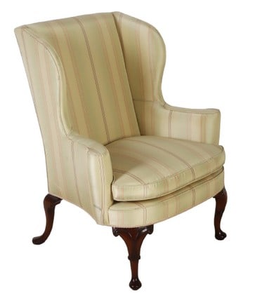 Queen Anne style upholstered wing chair: Queen Anne style upholstered wing chair, striped upholstery, mahogany feet with scrolled decoration, 42"h x 34"w x 27"d, light wear to fabric