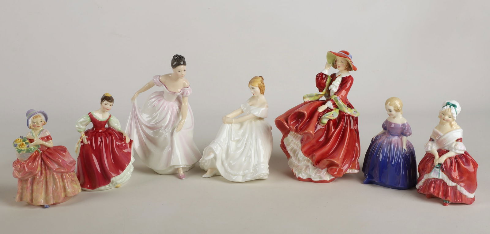 (6) Royal Doulton porcelain figures: (6) Royal Doulton porcelain figurines, including Heather HN 2956 (5-3/4" h), Top o' the Hill HN 1834 (7-1/2" h), Danielle HN 3001 (7-1/4" h), Peggy HN 2038 (5-1/4" h), Fair Maiden HN 2434 (5-1/4" h),
