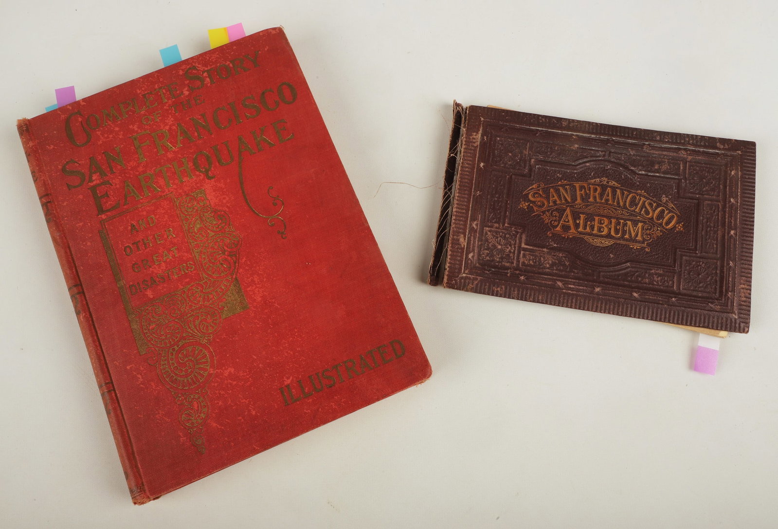 Books on San Francisco photos and earthquake: A souvenir book dating to about 1890 of views of San Francisco, titled San Francisco Album", and a copy of Complete Story of the San Francisco Earthquake by Marshall Everett (Chicago, n.d. but c. 1906