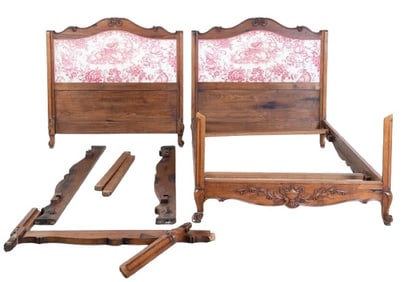 Pair French style carved walnut and upholstered beds