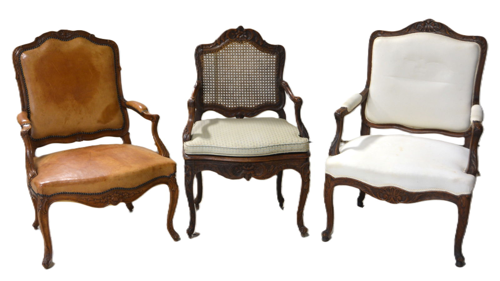(3) carved walnut fauteuils: (3) carved walnut fauteuils, c/o shell carved frame with white upholstery, floral carved frame with caned back and seat, green decorative cushion, floral carved frame with brown tacked leather, larges