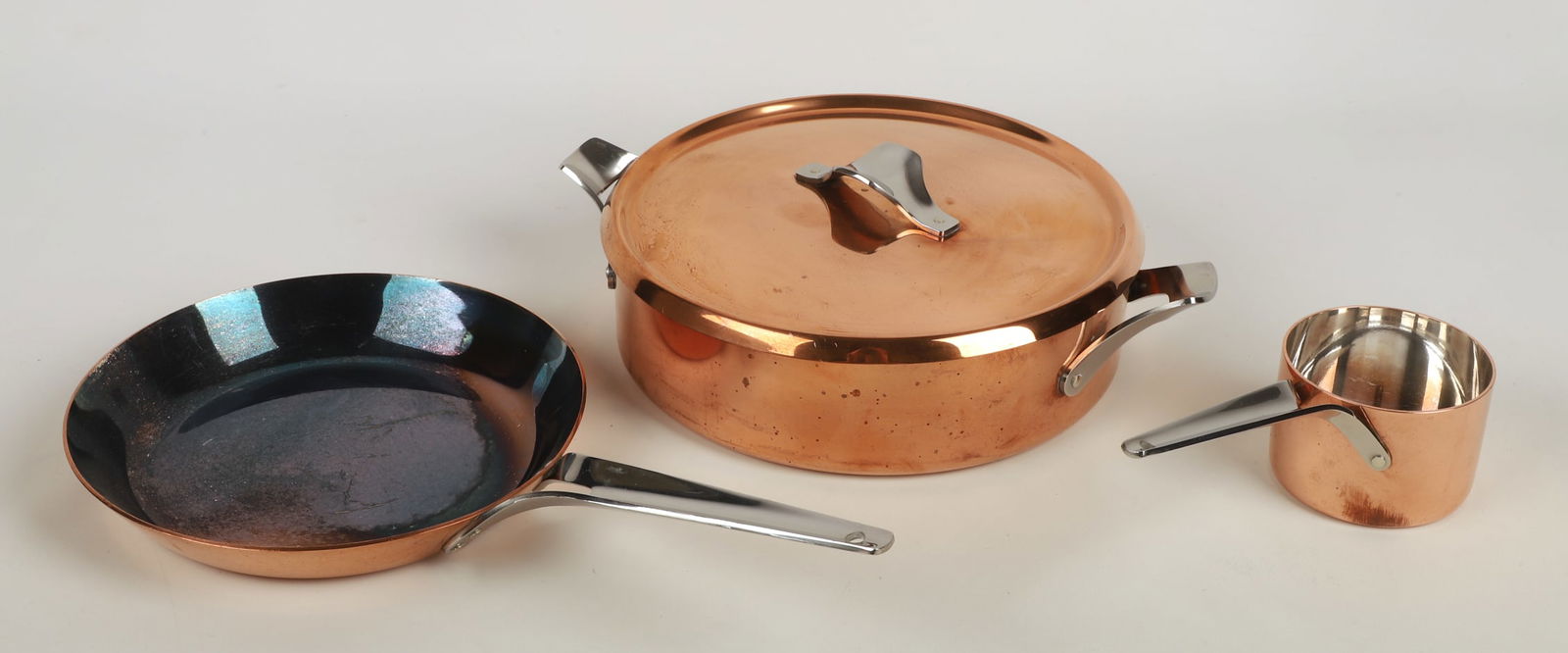 Henning Koppel for Georg Jensen Taverna Cookware: Henning Koppel (Danish, 1918-1981) for Georg Jensen Taverna Cookware to include a covered low pot, 13 /2" dia handle end to handle end, frying pan and sauce pot.