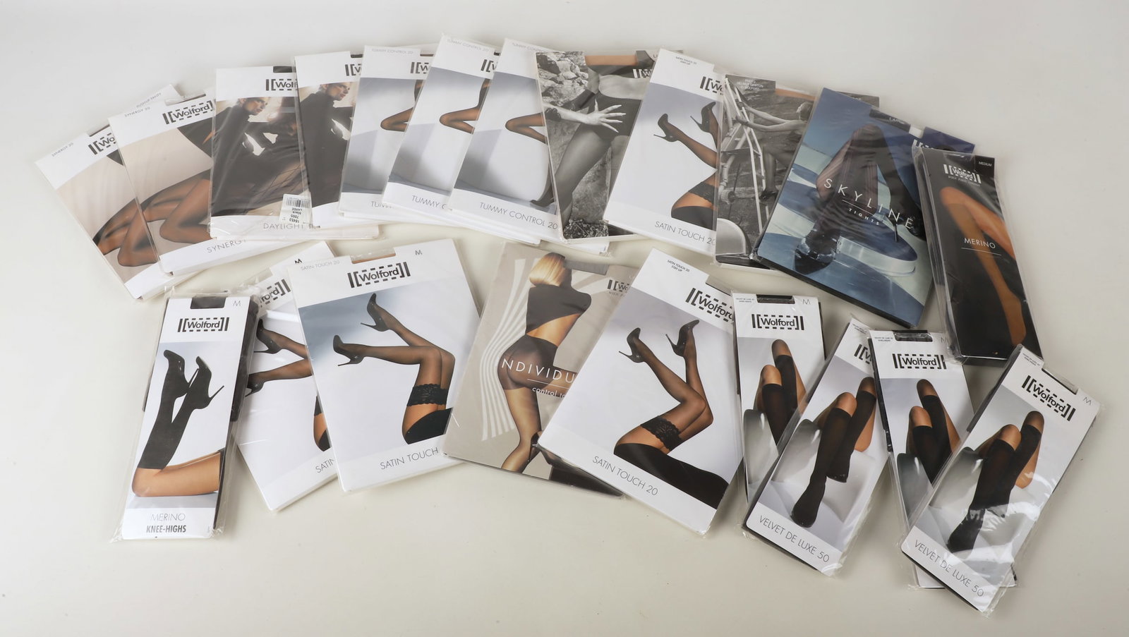 (21) NIB Wolford Tights and Knee Highs: (21) NIB Wolford Tights and Knee Highs to include (6) pairs knee highs, size M, and (15) pairs of tights, Medium and Large