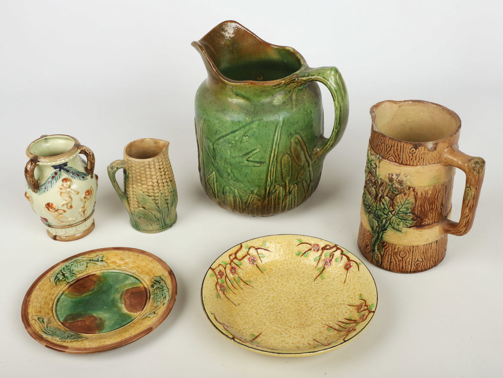 (6) Pieces of Majolica: (6) Pieces of Majolica, including Griffin Smith & Hill plate with basketweave border (7" dia), unmarked corn creamer (4-1/2" h, chip to foot), Japanese floral bowl (7-3/4" dia x 1-1/2" h), Japanese am
