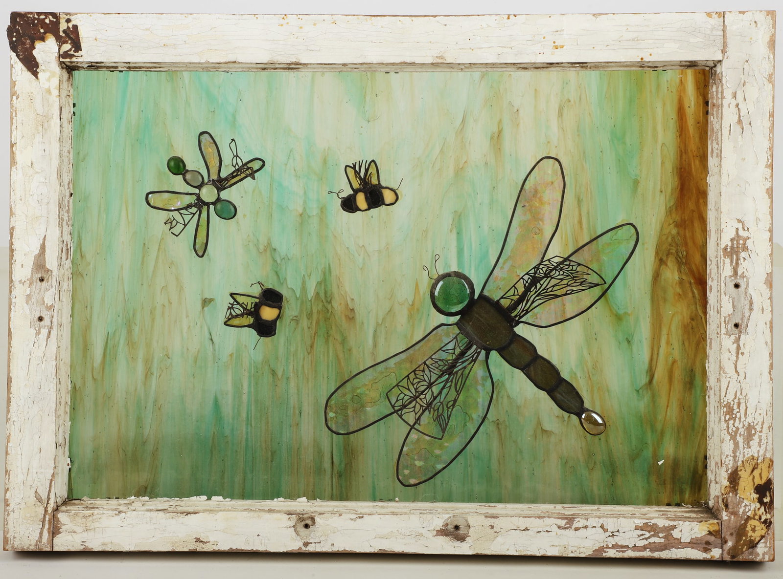 Stained glass dragonfly window: Stained glass dragonfly window, green & brown slag glass with applied dragonflies and bees, 15" x 21"