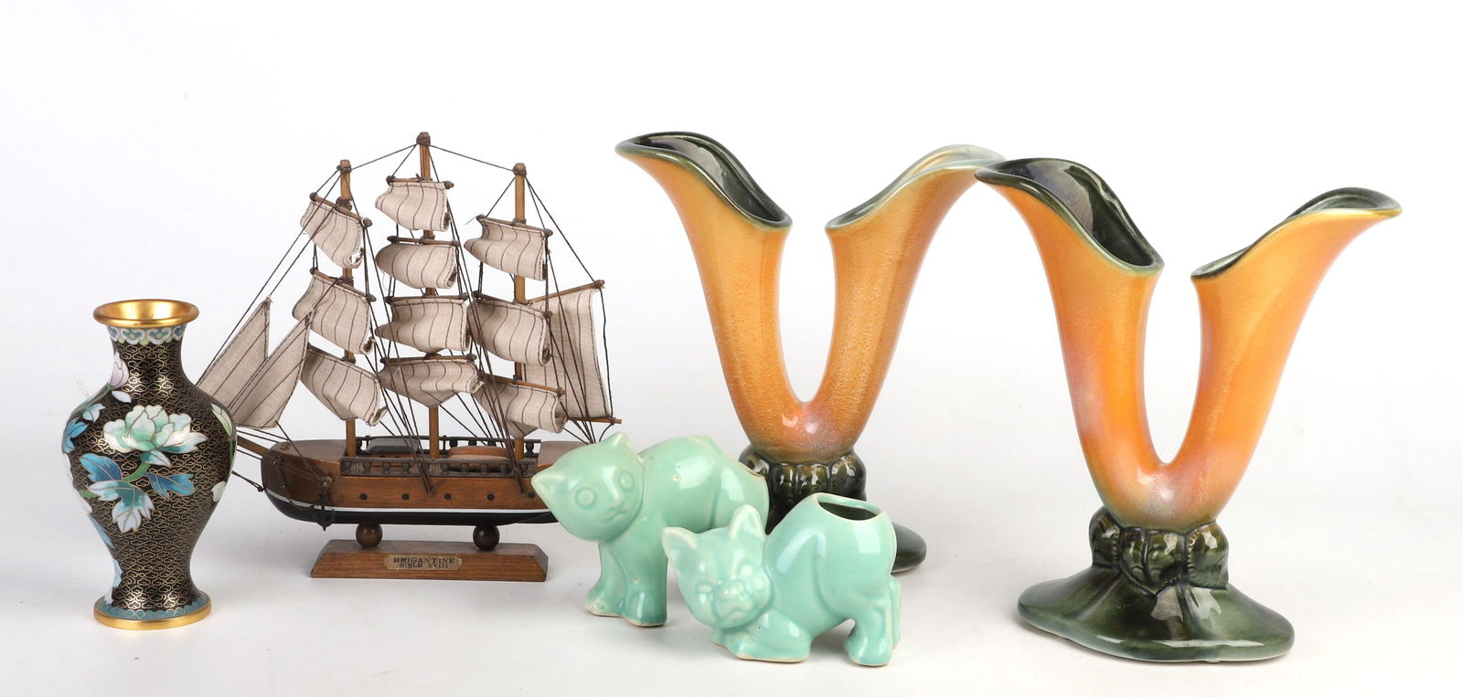 Hull Pottery, Ships Model and Enameled Vase: Hull Pottery, Ships Model and Enameled Vase to include a pair of 2-well unsigned mottled orange and green Hull vases, 9"H, a pair of cat form seafoam glazed pottery planters, a wood and cloth ships mo