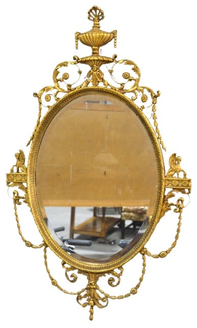 Friedman Brothers Italian style gilt hanging wall: Friedman Brothers Italian style gilt hanging wall, crest with run over scrolled acanthus and floral decoration, sides with sitting griffins on draped swag, 65"h x 35"w