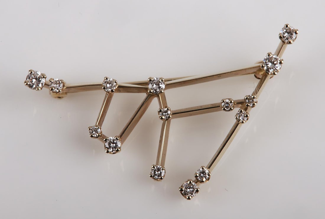 Aga Correa Diamond Capricorn Constellation Brooch: Aga Correa Diamond Capricorn Constellation Brooch, (15) round diamond set constellation form brooch in 14K white gold, stamped 14K, AGA at back, 1 5/8"L x 1 1/8"H, 2.5 DWT, 2.2 mm largest diamond, con