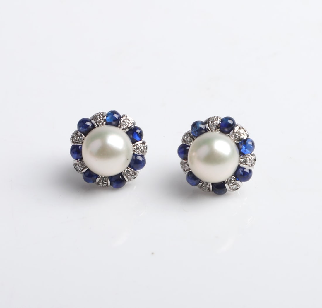 18K Pearl Centered Sapphire and Diamond Earrings: 18K Pearl Centered Sapphire and Diamond Earrings, 9.1 mm center pearl in alternatings 2.7 mm sapphire cabochon and diamond pave petals, set in 18K white gold, stamped 18K Italy at back, 14.5 mm dia ov