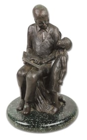 Bronze Sculpture of Man Reading to Child