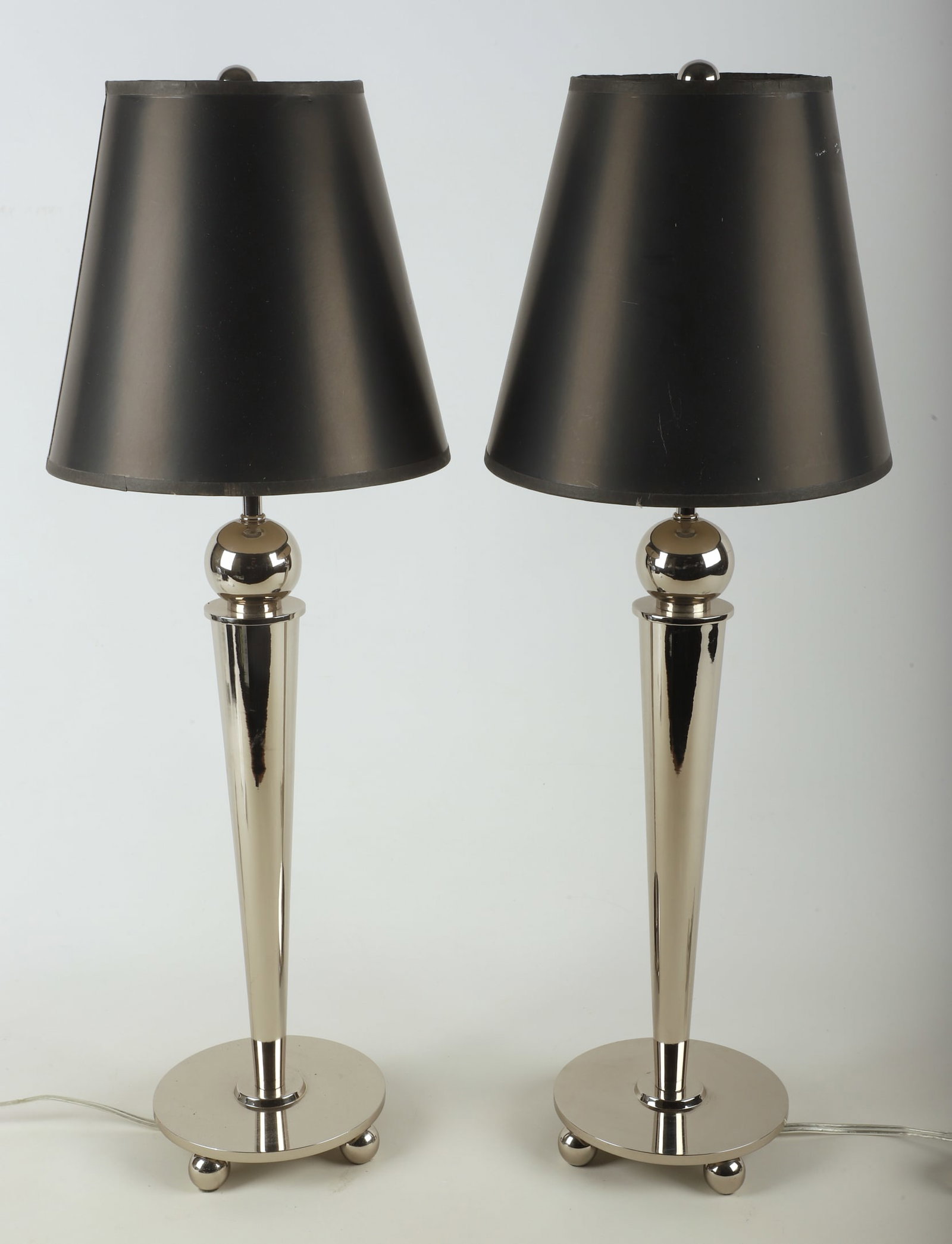 Tapered Chrome Lamp Pair: Tapered Chrome lamp pair, raised on ball foot, each with matched black shade, 28"H, Michael Graves style.