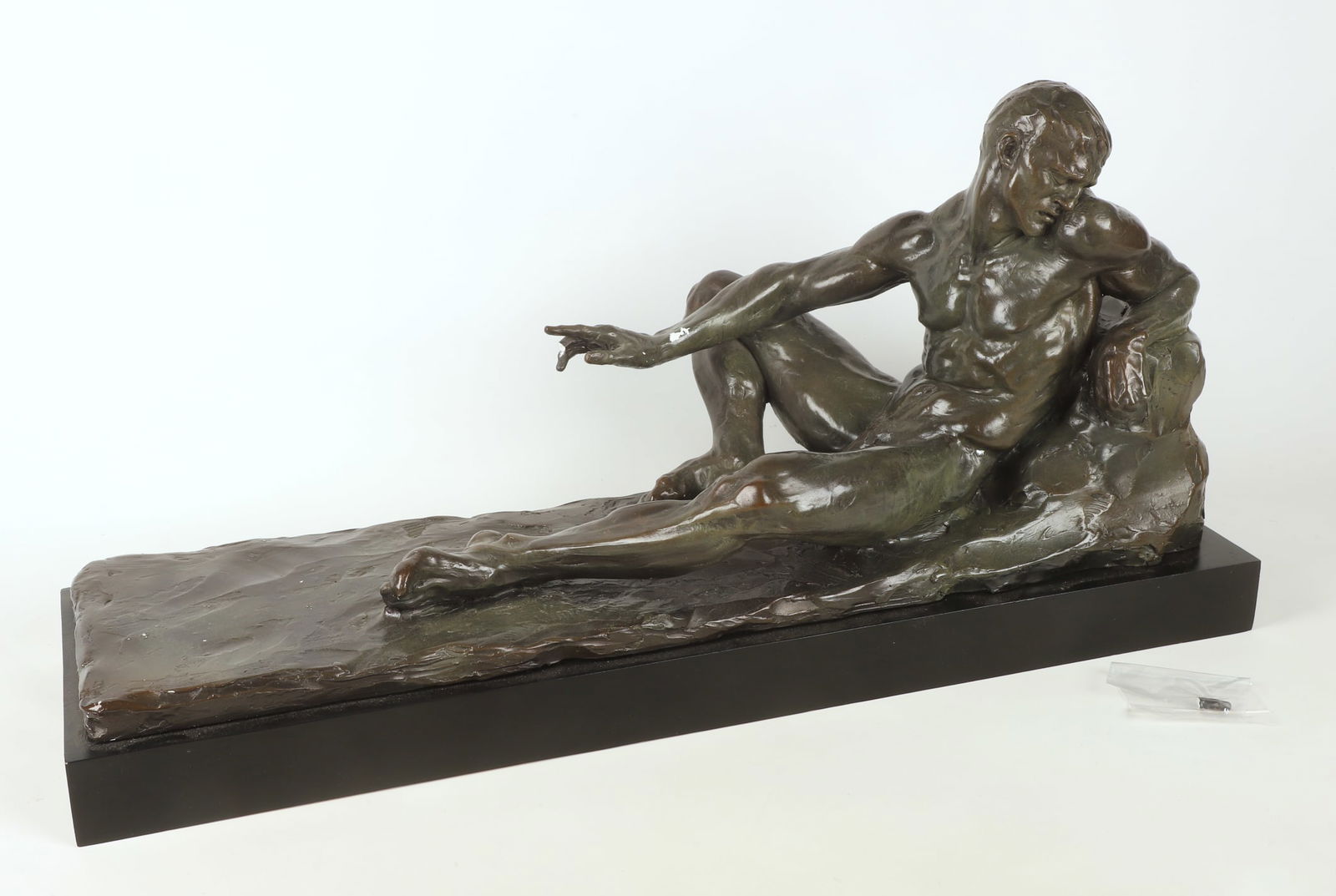 Lee Dunsmore Plaster Sculpture of a Nude Man: Lee Dunsmore (American, 20th/21st C.) plaster sculpture of a nude man, in patinated paint decoration, signed Dunsmore, with (2) fingers broken off, (1) of which included for repair, the paint flaking