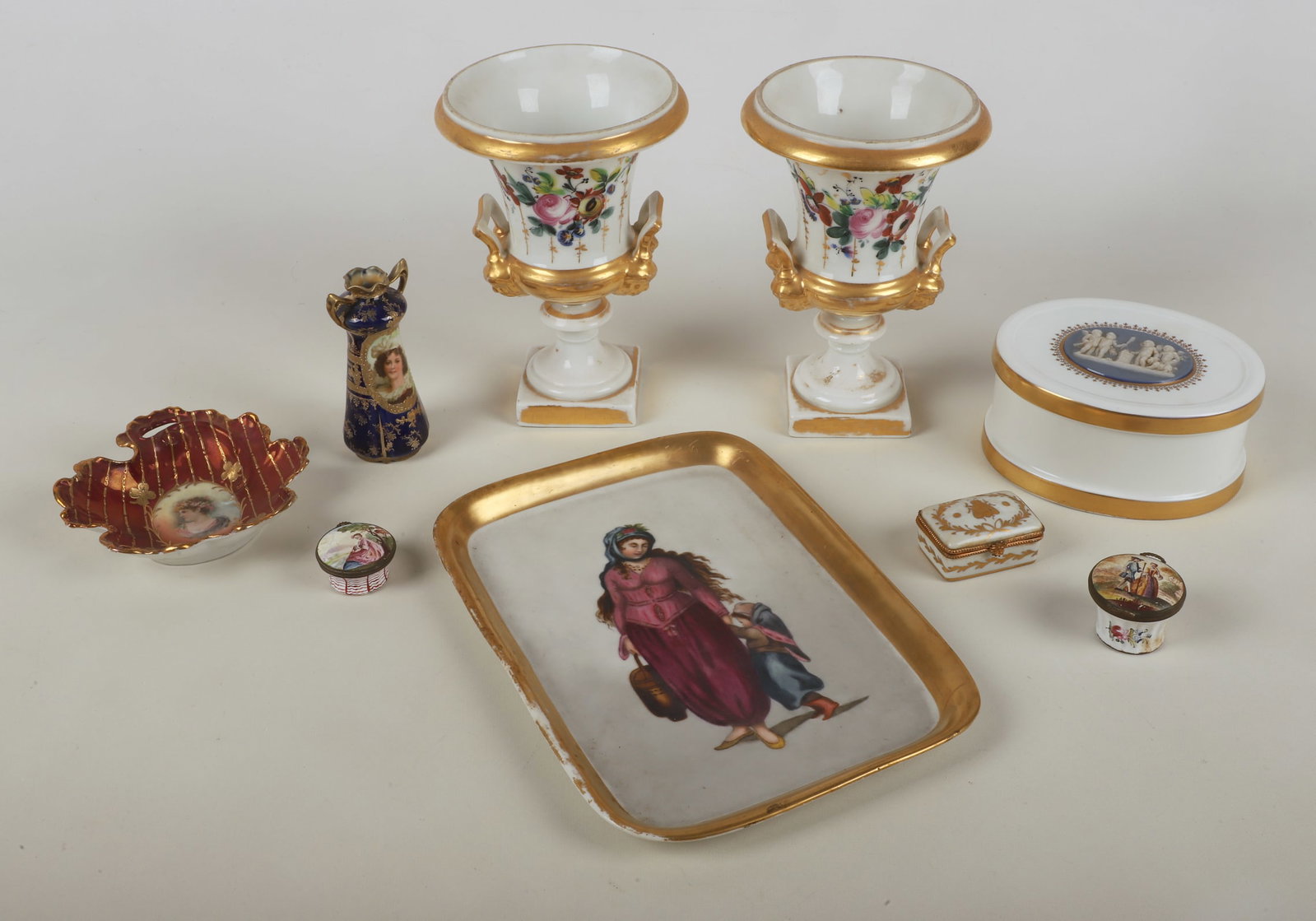 A Collection of Porcelain Decor & Collectibles: A Collection of Porcelain decor and collectibles to include a Royal Saxe Germany porcelain leaf form dish, in transfer and parcel gilt decoration, 5 1/2" dia, a Royal Vienna porcelain minature cabinet