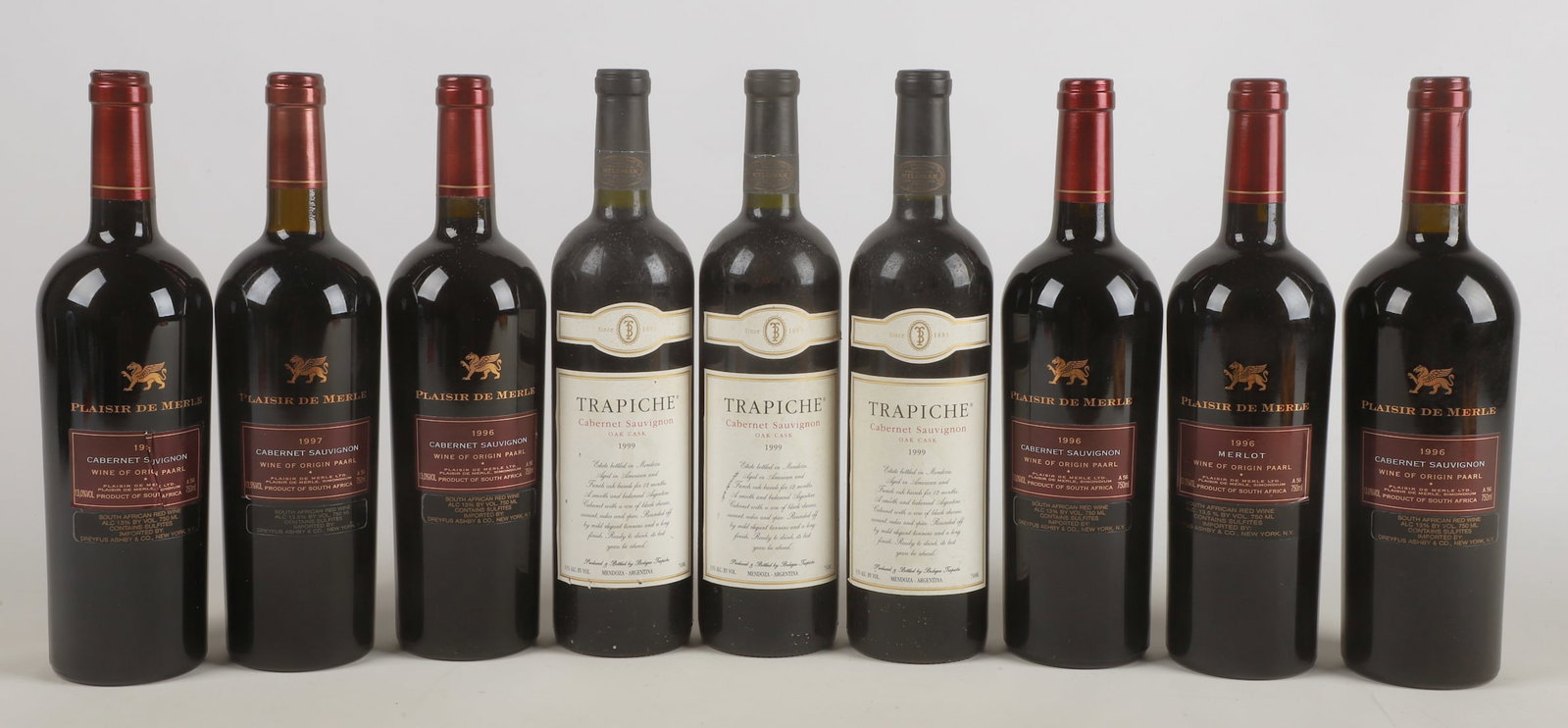 (9) Bottles of Wine: (9) Bottles of wine to include (6) bottles Plasir de Merle cabernet sauvignon, (5) of which 1996, (1) of which 1997, and (3) 1999 Trapiche Sabernet Sauvignon, stored in an underground wine cellar.