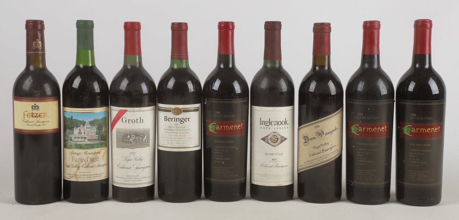 (9) Bottles of Wine: (9) Bottles of wine to include (3) 1984 Carmenet Estate bottled red, (1) 1993 Beringer Vineyards Rhine House Selection Cabernet Sauvignon, (1) 1986 Dunn Vineyards Napa Valley Cabernet Sauvignon, (1) 1