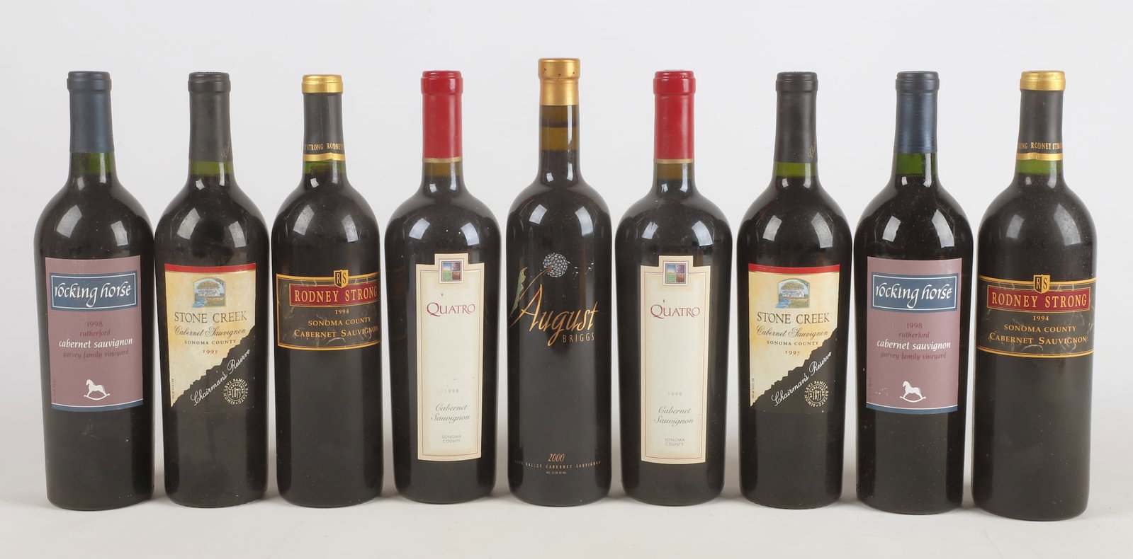 (9) Bottles of Wine: (9) Bottles of wine to include (2) 1994 Rodney Strong Cabernet Sauvignon, (2) 1995 Stone Creek Chairman's Reserve Cabernet Sauvignon, (2) 1998 Rocking Horse Garvey Family Vineyard Cabernet Sauvignon, 